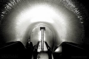 Man ascending escalator, Lisbon 2019