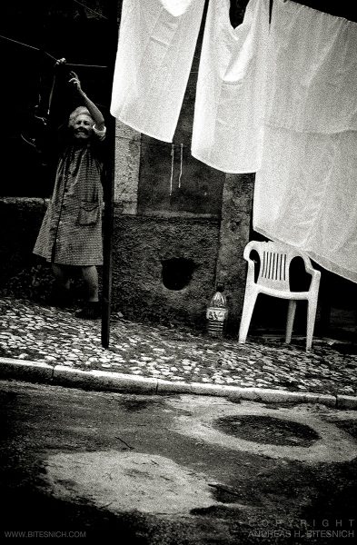 Woman hanging up laundry, Lisbon 2018