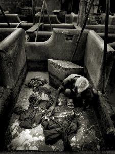 Man working at open laundry, Mumbai, India 2006
